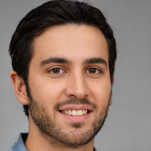 Joyful white young-adult male with short  brown hair and brown eyes