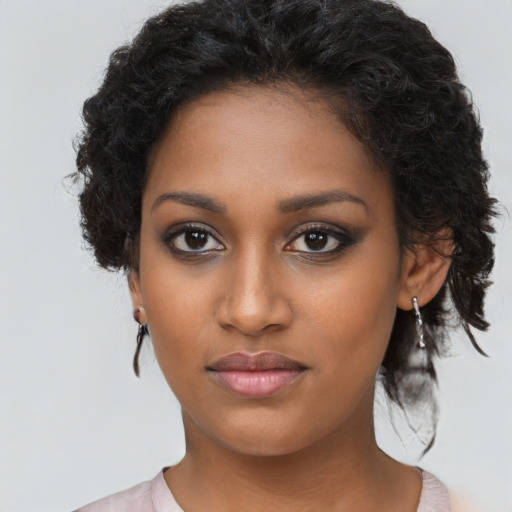 Neutral black young-adult female with long  brown hair and brown eyes