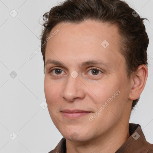 Joyful white adult male with short  brown hair and brown eyes