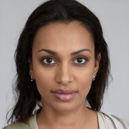 Neutral black young-adult female with long  brown hair and brown eyes