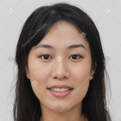 Joyful asian young-adult female with long  brown hair and brown eyes