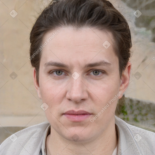 Joyful white adult female with short  brown hair and grey eyes