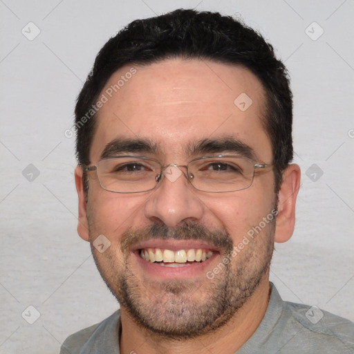 Joyful white adult male with short  black hair and brown eyes