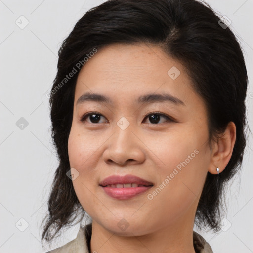 Joyful asian young-adult female with medium  brown hair and brown eyes