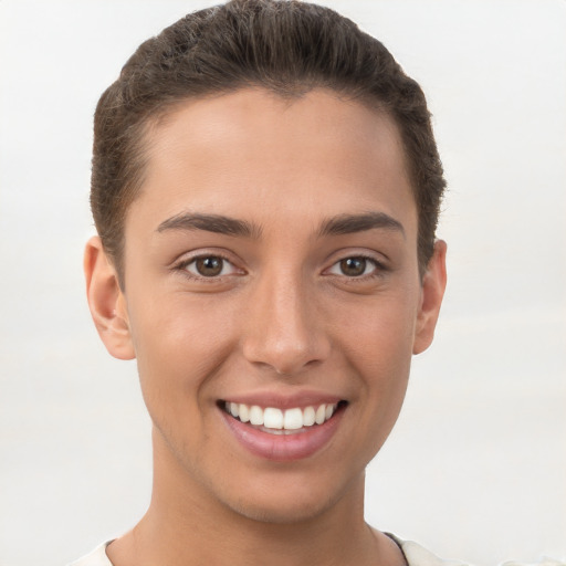 Joyful white young-adult female with short  brown hair and brown eyes