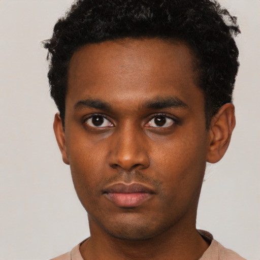 Neutral black young-adult male with short  black hair and brown eyes