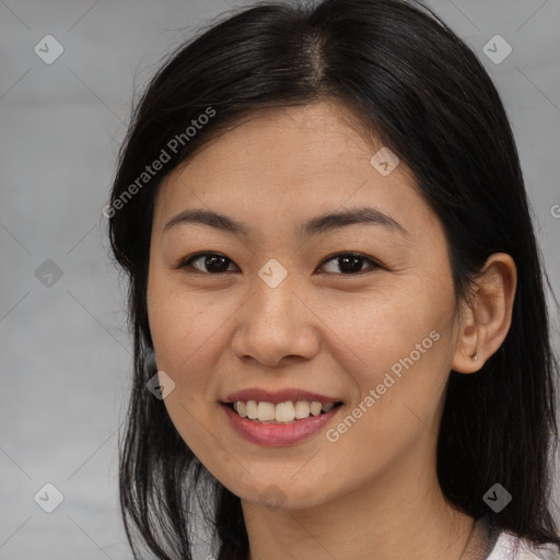 Joyful asian young-adult female with medium  brown hair and brown eyes