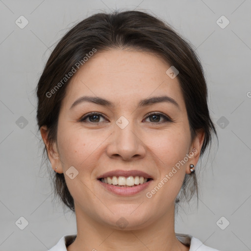 Joyful white young-adult female with medium  brown hair and brown eyes