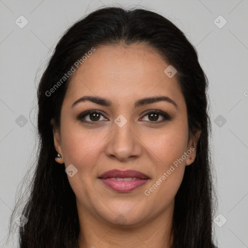 Joyful latino young-adult female with long  brown hair and brown eyes