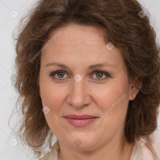 Joyful white adult female with medium  brown hair and green eyes