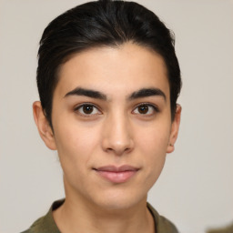 Joyful latino young-adult male with short  brown hair and brown eyes