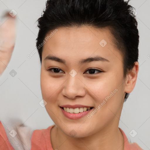 Joyful asian young-adult female with short  brown hair and brown eyes