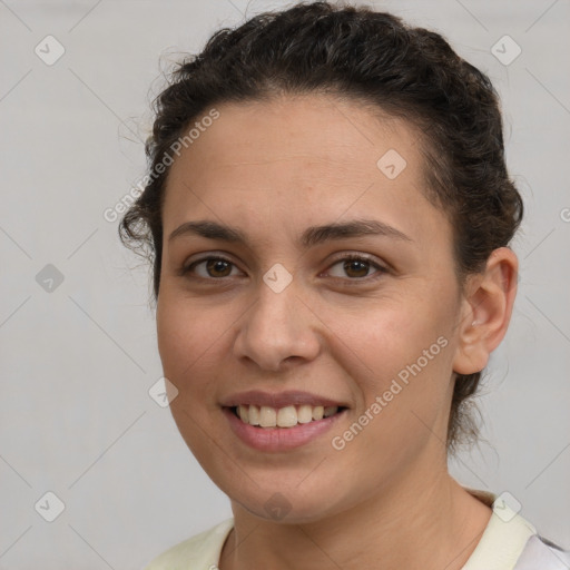 Joyful white young-adult female with short  brown hair and brown eyes