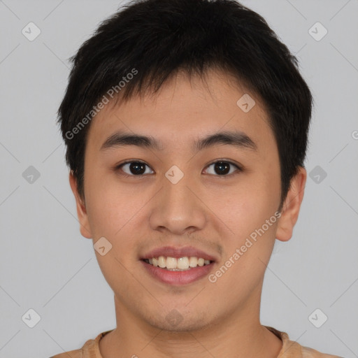 Joyful asian young-adult male with short  brown hair and brown eyes