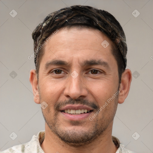 Joyful white adult male with short  brown hair and brown eyes