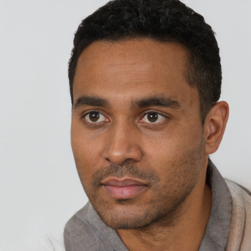 Neutral black young-adult male with short  black hair and brown eyes