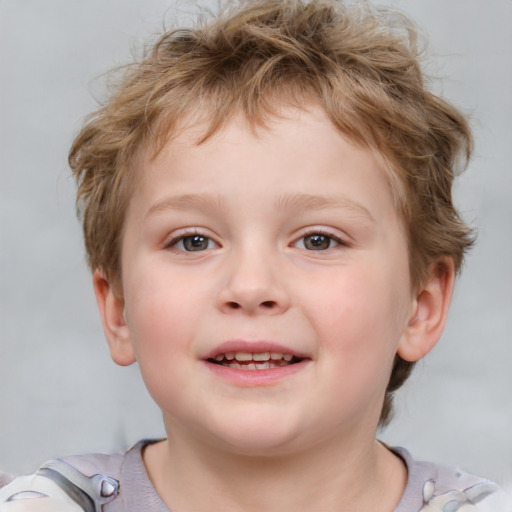 Joyful white child male with short  brown hair and brown eyes