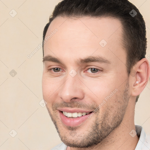 Joyful white young-adult male with short  brown hair and brown eyes