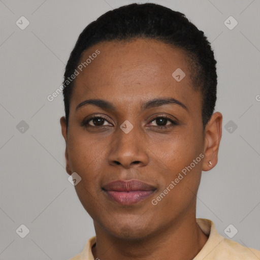 Joyful black young-adult female with short  black hair and brown eyes