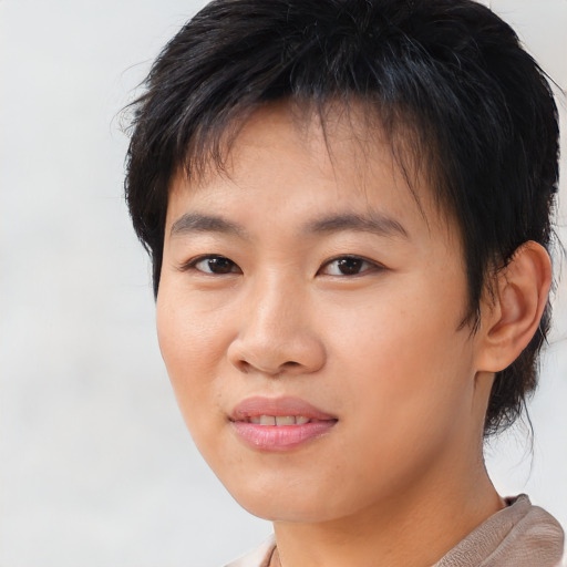 Joyful asian young-adult female with short  brown hair and brown eyes
