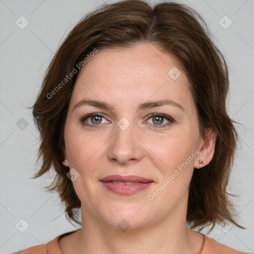 Joyful white young-adult female with medium  brown hair and green eyes