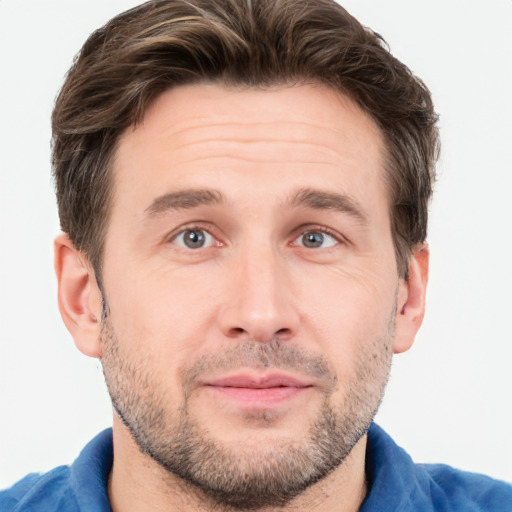 Joyful white adult male with short  brown hair and grey eyes