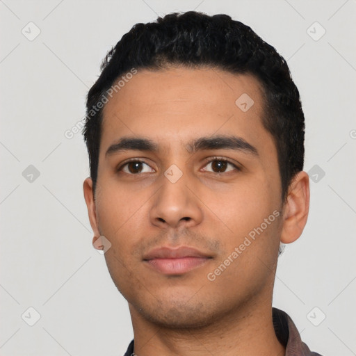 Neutral latino young-adult male with short  black hair and brown eyes