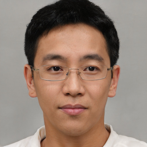 Neutral asian adult male with short  brown hair and brown eyes