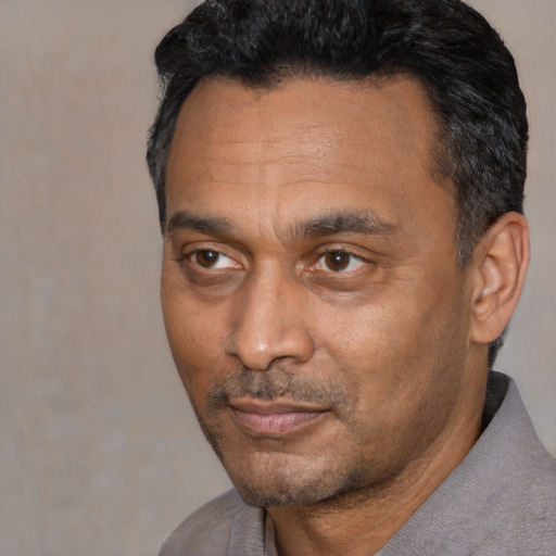 Neutral latino adult male with short  black hair and brown eyes