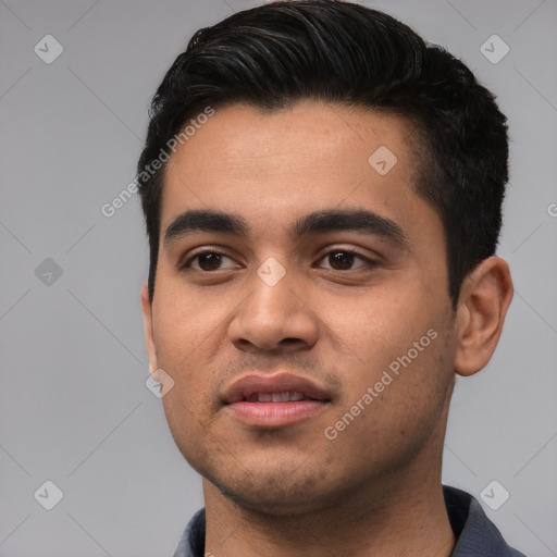 Joyful latino young-adult male with short  black hair and brown eyes