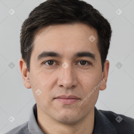 Joyful white young-adult male with short  brown hair and brown eyes