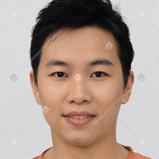 Joyful asian young-adult male with short  black hair and brown eyes