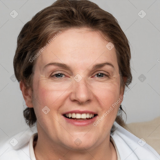 Joyful white adult female with medium  brown hair and blue eyes