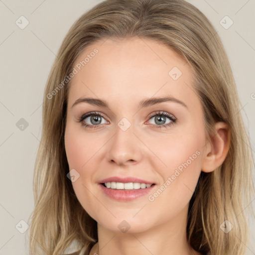 Joyful white young-adult female with long  brown hair and grey eyes