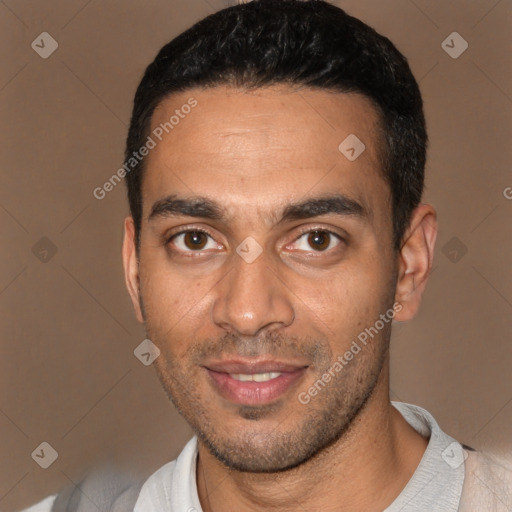 Joyful white young-adult male with short  black hair and brown eyes
