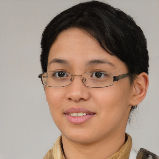 Joyful asian young-adult female with short  brown hair and brown eyes