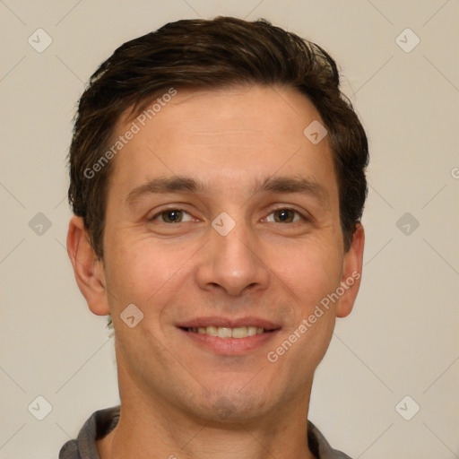 Joyful white adult male with short  brown hair and brown eyes