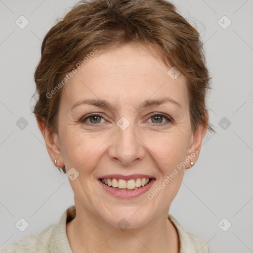 Joyful white adult female with short  brown hair and brown eyes