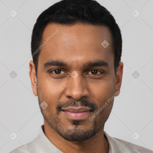 Joyful black young-adult male with short  black hair and brown eyes