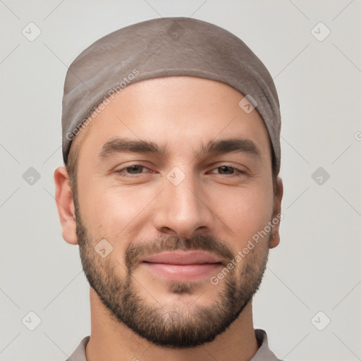 Joyful white young-adult male with short  black hair and brown eyes