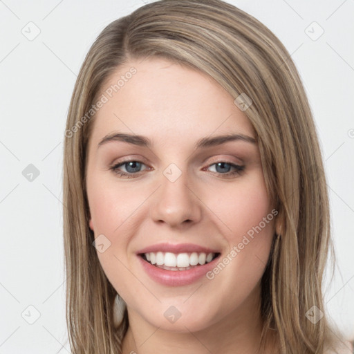 Joyful white young-adult female with long  brown hair and green eyes