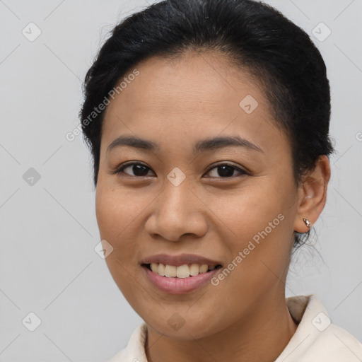 Joyful asian young-adult female with short  brown hair and brown eyes