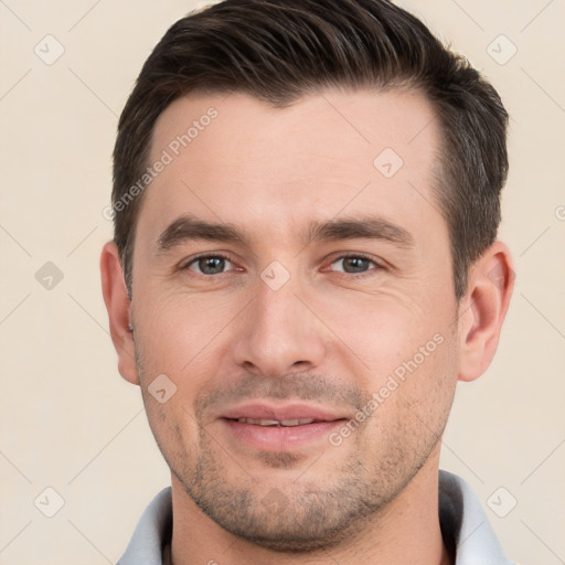 Joyful white young-adult male with short  brown hair and brown eyes