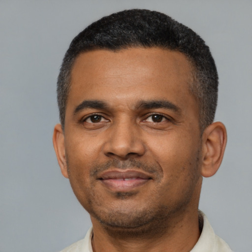 Neutral latino adult male with short  black hair and brown eyes
