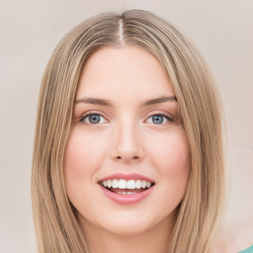 Joyful white young-adult female with long  brown hair and green eyes