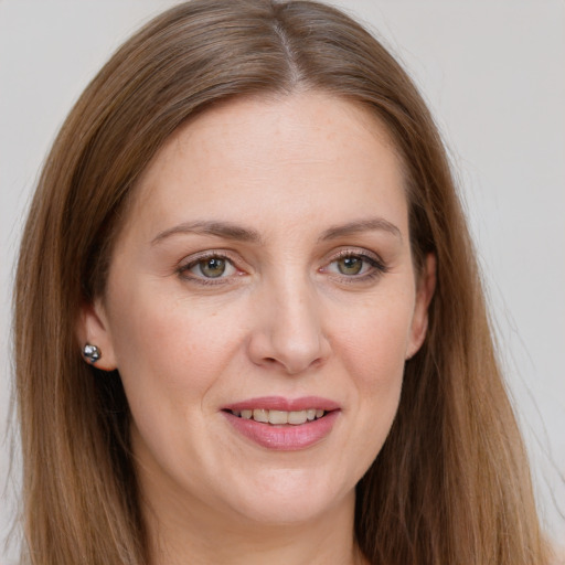 Joyful white young-adult female with long  brown hair and grey eyes