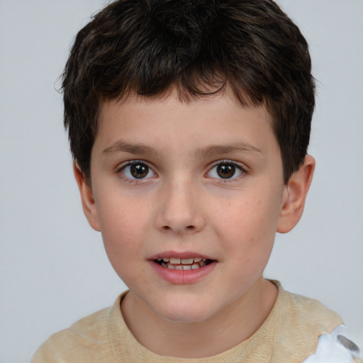 Joyful white child male with short  brown hair and brown eyes