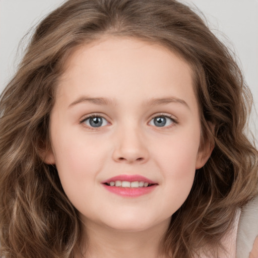 Joyful white child female with long  brown hair and brown eyes