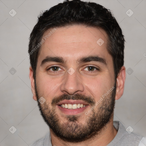 Joyful white young-adult male with short  black hair and brown eyes