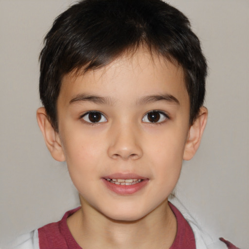 Joyful white child male with short  brown hair and brown eyes